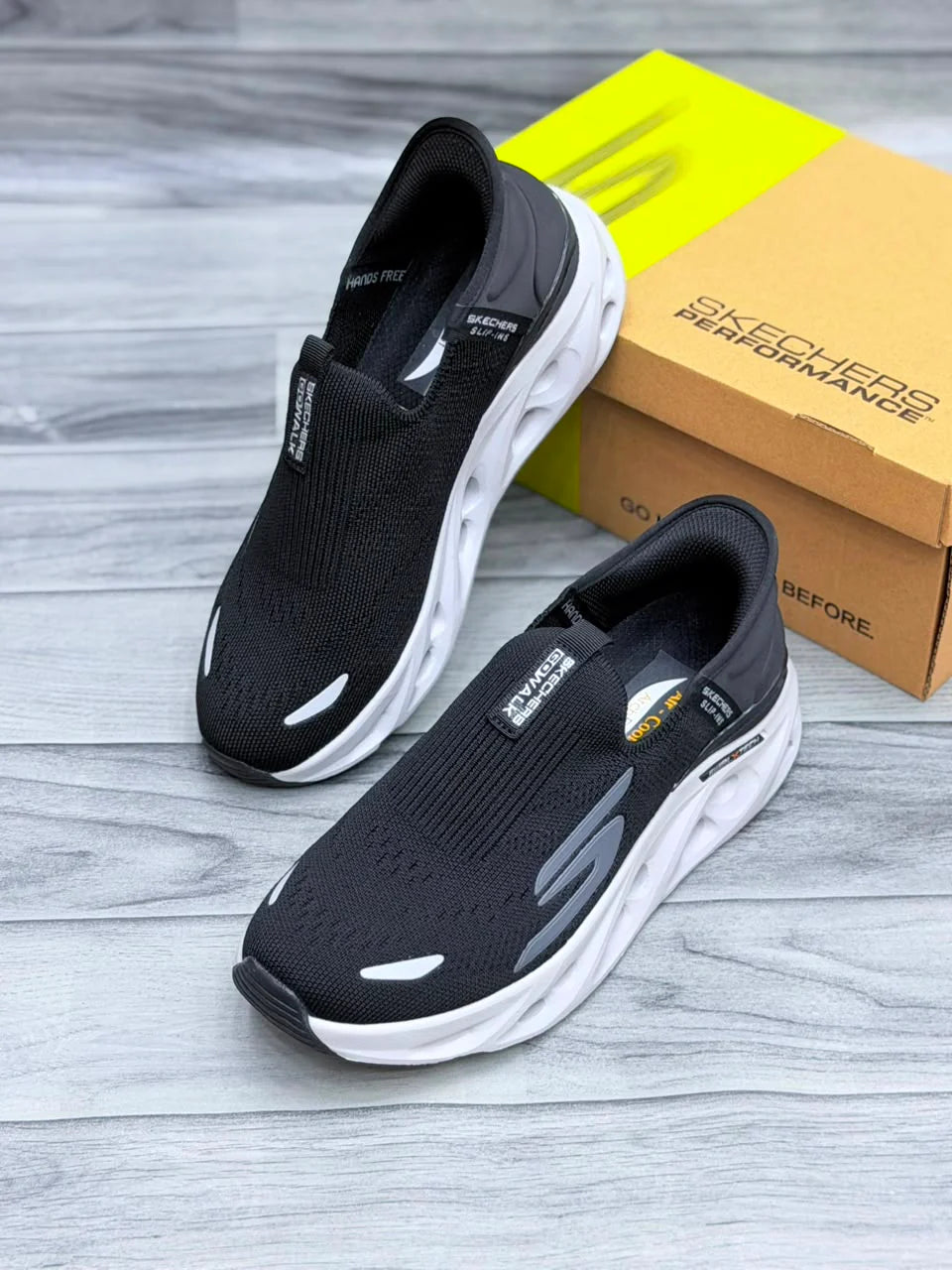 SKECHERS HANDS FREE SWIRL X TECH SLIP INN BLACK AND WHITE